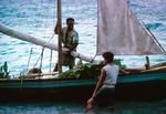 Arrival of tulula harvesting canoe named 'Lupe' with harvest