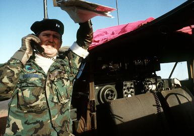 A forward air controller, using a radio, directs an F-4E Phantom II aircraft toward a bomb target. The controller is from the 22nd Tactical Air Support Squadron, involved in Exercise Opportune Journey 4