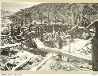 PORT MORESBY, NEW GUINEA. 1944-04-15. THE BASILISK BATTERY GUN PIT FORMING PART OF THE PORT MORESBY 5.25 INCH ANTI-AIRCRAFT COASTAL ARTILLERY UNDER CONSTRUCTION BY THE 8TH ARMY TROOPS COMPANY, ..