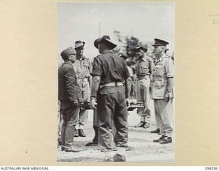 CAPE WOM, NEW GUINEA, 1945-09-13. LT-GEN H. ADACHI, COMD 18 JAPANESE ARMY IN NEW GUINEA, FORMALLY SURRENDERED TO MAJ-GEN H.C.H. ROBERTSON, GOC 6 DIVISION, IN A CEREMONY HELD AT CAPE WOM AIRSTRIP. ..