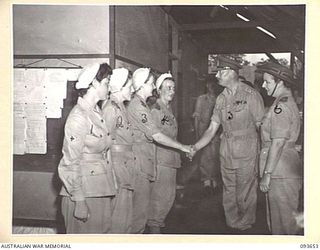 TOROKINA, BOUGAINVILLE, 1945-07-03. HIS ROYAL HIGHNESS, THE DUKE OF GLOUCESTER, GOVERNOR-GENERAL OF AUSTRALIA (5), IS INTRODUCED BY LIEUTENANT-COLONEL M.E. HURLEY, MATRON (6), TO SISTER E.M. ..