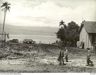 JACQUINOT BAY, NEW BRITAIN. 1944-12-18-20. LOOKING NORTH DOWN TO THE MALMAL MISSION JETTY WITH THE ROMAN CATHOLIC MISSION CHURCH ON THE RIGHT