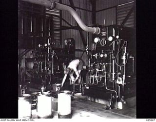 BOMANA, NEW GUINEA. 1943-11-08. INTERIOR OF THE BOMANA PUMPING STATION WHICH SUPPLIES PORT MORESBY WITH 1,000,000 GALLONS OF FILTERED WATER DAILY, DRAWN FROM THE LALOKI RIVER