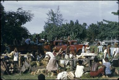 Red lorries belonging to Tolai people at the native market : Rabaul, New Britain, Papua New Guinea, 1960-1961 / Terence and Margaret Spencer