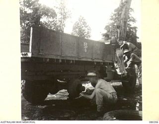 A CAPTURED JAPANESE TRUCK AT THE TRANSPORT SECTION, HEADQUARTERS NEW GUINEA FORCE, BEING RE-CONDITIONED FOR USE BY THE UNIT
