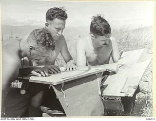 NEW GUINEA. UPPER RAMU VALLEY ADVANCE. AN AUSTRALIAN SHIP IN THE URIA VALLEY COVERS THE JAPANESE ROAD TO MADANG. LT. R. MARSTON OF BRIGHTON, VIC., LT. C. CARROLL OF EBERTONE, VIC., LT. T. FEELY OF ..