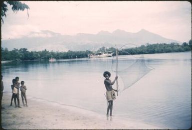 Fishing net: Fergusson Island mountains in the background : Kalo Kalo Methodist Mission Station, D'Entrecasteaux Islands, Papua New Guinea 1956-1958 / Terence and Margaret Spencer