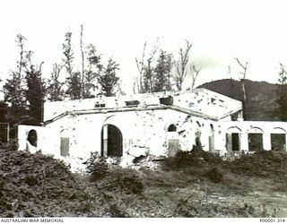 NEW BRITAIN 1945-09. WAR DAMAGED BUILDING AT RABAUL. (RNZAF OFFICIAL PHOTOGRAPH.)