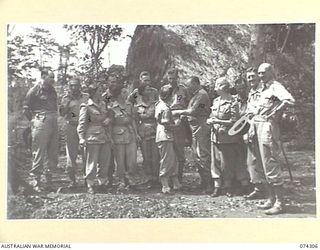 MADANG, NEW GUINEA. 1944-07-27. MEMBERS OF THE EMPIRE PARLIAMENTARY DELEGATION CHATTING WITH MEMBERS OF THE STAFF OF THE 2/7TH AUSTRALIAN GENERAL HOSPITAL DURING THEIR INSPECTION OF THE UNIT. ..