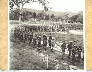 POM POM VALLEY, NEW GUINEA. 1943-11-30. 2/12TH AUSTRALIAN INFANTRY BATTALION, MARCHING OFF THE SPORTSGROUND AFTER AN INSPECTION BY THEIR COMMANDING OFFICER, QX6008 LIEUTENANT COLONEL C. C. F. ..