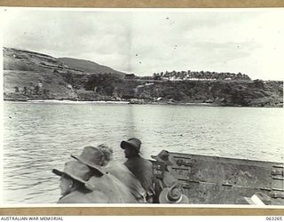 WALINGAI BEACH, NEW GUINEA. 1944-01-02. A JOIN UP VIEW OF THE BEACH FROM A LANDING BARGE, SHOWING A SUNKEN JAPANESE BARGE IN THE CENTRE OF THE PHOTOGRAPH (TO JOIN TO PHOTOGRAPH NO. 63264)