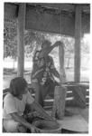 Man preparing kava by pounding.