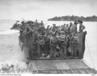 LANGEMAK BAY, NEW GUINEA. 1943-10-20. LANDING CRAFT LOADED WITH TROOPS OF THE 2/24TH AUSTRALIAN INFANTRY BATTALION, EN ROUTE FOR LAUNCH JETTY AND THE FINSCHHAFEN CAMPAIGN BATTLE AREA. SHOWN: ..