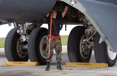 U.S. Air Force SENIOR AIRMAN Matt Gilbert, 36th Expeditionary Aircraft Maintenance Squadron, 36th Air Expeditionary Wing, Andersen Air Force Base, Guam, performs routine maintenance on a USAF B-52 Stratofortress after a training sortie on Sept. 7, 2004. (U.S. Air Force photo by AIRMAN First Class Kristin Ruleau) (Released)