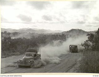 1943-06-18. NEW GUINEA. WITH THE BEGINNING OF THE DRY SEASON SOME OF THE ROADS IN NEW GUINEA HAVE BECOME AS DUSTY AS ANY IN THE MIDDLE EAST. BAD THOUGH THE DUST IS, THE AUSTRALIANS PREFER IT TO THE ..