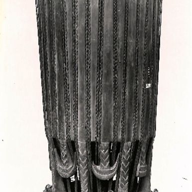 Photo of Wooden object with sinnet woven through. British Musem