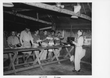 United States Navy Episcopal Chaplain holding "Sunday" school