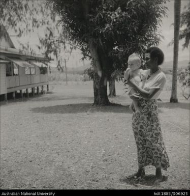 Fijian woman holding child