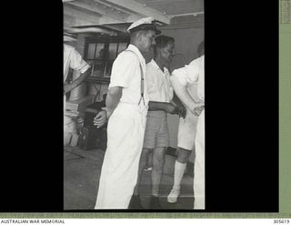 EMIRAU ISLAND. THE CAPTAIN OF THE NORWEGIAN MERCHANT VESSEL VINNI WITH CAPTAIN UPTON OF THE BRITISH VESSEL RANGITANE, BOTH OF WHOSE SHIPS WERE SUNK BY GERMAN RAIDERS KOMET AND ORION IN THE PACIFIC, ..