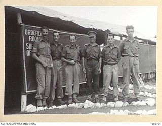 CAPE WOM, WEWAK AREA, NEW GUINEA, 1945-07-02. A GROUP OF HEADQUARTERS STAFF AT 2/22 SUPPLY DEPOT PLATOON. IDENTIFIED PERSONNEL ARE:- STAFF-SERGEANT M.J. HILLS (1); CAPTAIN J.L. TINKER, OFFICER ..