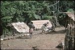 Three women just above menstrual huts