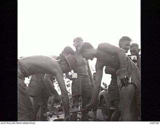 DONADABU, NEW GUINEA. 1943-11-03. SAPPERS OF THE 18TH AUSTRALIAN FIELD COMPANY, ROYAL AUSTRALIAN ENGINEERS, REMOVING OLD DECKING AND GIRDERS FROM A BRIDGE WHICH THEY ARE REBUILDING OVER THE EWARIGO ..
