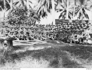 SIAR, NEW GUINEA. 1944-06-18. AUSTRALIAN ARMY OFFICERS ASSEMBLED AT HEADQUARTERS, 15TH INFANTRY BRIGADE FOR A TACTICAL EXERCISE ON A SAND TABLE. IDENTIFIED PERSONNEL ARE:- VX89390 LIEUTENANT A.B. ..