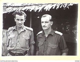 CAPE WOM, WEWAK AREA, NEW GUINEA. 1945-08-31. CAPTAIN F.E. COLINGS, ALLIED TRANSLATOR AND INTELLIGENCE SERVICE (1) AND CAPTAIN J.O. MOULDEN, G111 (1) (2), STAFF OFFICERS, HEADQUARTERS ROYAL ..