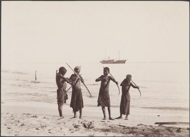 Four Guadalcanar boys with bows and arrows, Southern Cross in background, Solomon Islands, 1906 / J.W. Beattie