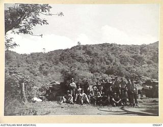 RABAUL, NEW BRITAIN. 1945-09-15. FOLLOWING THE SURRENDER OF THE JAPANESE, AUSTRALIAN TROOPS ARE USING THIS SITE, IN THE MALAGUNA ROAD AREA, FOR 22ND INFANTRY BATTALION STORES. BEFORE THE INVASION ..