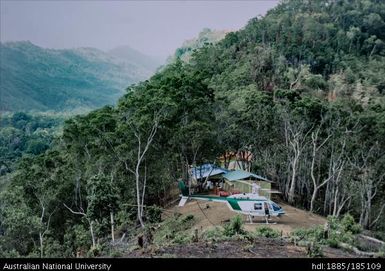 Wapolu, helicopter landed at Wapolu mining camp