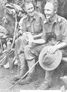 SHAGGY RIDGE, NEW GUINEA. 1943-12-27. WX17091 PADRE C. W. J. CUNNINGHAM MBE (ROMAN CATHOLIC) (1) AND WX1597 MAJOR W. G. SYMINGTON (2) OF THE 2/16TH AUSTRALIAN INFANTRY BATTALION, 21ST AUSTRALIAN ..