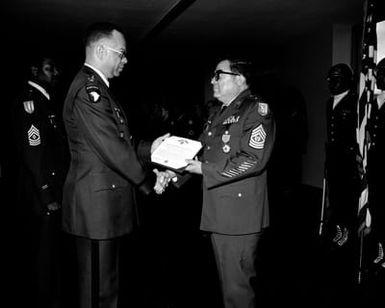 Upon his retirement after completing 30 years of service, CSM Jose G.C. Palau receives the Legion of Merit from COL William J. Stephens, Commander, U.S. Army Communications Command, Operations Command, in a ceremony at the Pentagon