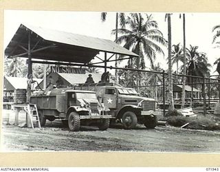 MILNE BAY, PAPUA. 1944-04-03. AUSTRALIAN AND AMERICAN MOTOR TANKERS BEING FILLED WITH 80 OCTANE MOTOR SPIRIT AT THE 2ND BULK PETROLEUM STORAGE COMPANY. THE FUEL IS FOR DISTRIBUTION TO MOTOR ..