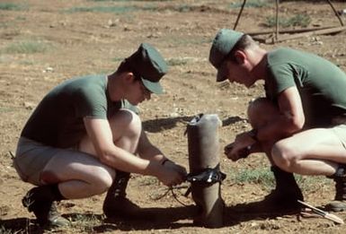 SSGT Tynan and MSGT Williams prepare the charge on the bomb for the combat control team (CCT)