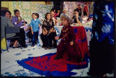 Kayne Lucas Upokokeu dances after his hair-cutting ceremony