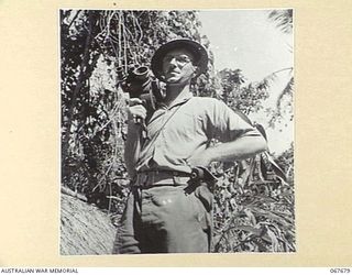 NEW GUINEA. 1944-07. NX95472 LIEUTENANT F.S. WOOD, CINEMATOGRAPHER OF THE MILITARY HISTORY SECTION