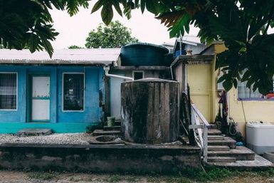 Water tanks between two homes, Fakaofo, Tokelau