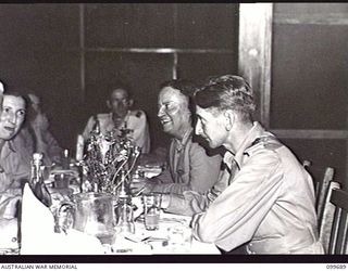 LAE, NEW GUINEA, 1946-01-27. LIEUTENANT-GENERAL H. C. H. ROBERTSON, GENERAL OFFICER COMMANDING FIRST ARMY, TALKING TO THE HONOURABLE F. M. FORDE, MINISTER FOR THE ARMY, DURING DINNER AT THE ..