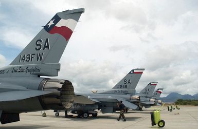 US Air Force (USAF) F-16C Fighting Falcon aircraft assigned to the 149th Fighter Wing (FW),Texas Air National Guard (TXANG), line the flight pad at Hickam Air Force Base (AFB), Hawaii, as they prepare to participate with members assigned to the 25th Air Support Operation Squadron (ASOS), in an training exercise called, "Sentry Strike."