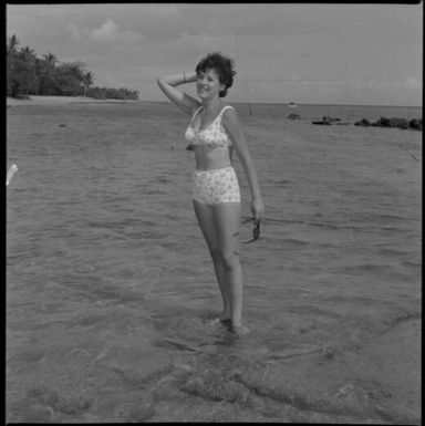 Miss Maglia wearing a bikini and standing in the sea at Suva, Fiji, 22 February 1966 [2] John Mulligan