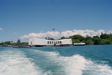 View of the USS ARIZONA Memorial which spans the wreck of the battleship USS ARIZONA (BB 39) at Fox no. 7 of battleship row alongside Ford Island. The ARIZONA was sunk at approximately 0805 on December 7, 1941 during the Japanese attack on Pearl Harbor, which brought the United States of America into the conflict of the Second World War