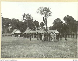 LAE, NEW GUINEA. 1945-03-27. LORD WAKEHURST, KCMG, GOVERNOR OF NEW SOUTH WALES (2), ACCOMPANIED BY N445244 CAPTAIN A.M. SINCLAIR, OFFICER COMMANDING POLICE TRAINING DEPOT, ROYAL PAPUAN CONSTABULARY ..