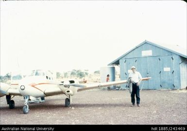 Man standing with plane