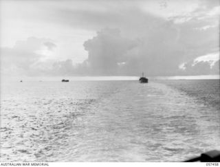 FINSCHHAFEN, NEW GUINEA, 1943-09-22. FINSCHHAFEN FORCE CONVOY APPROACHING THE COAST. LCI'S (LANDING CRAFT INFANTRY) WHICH HAVE DISEMBARKED TROOPS, CAN BE SEEN ON THE HORIZON