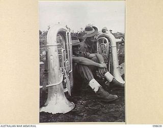 WEWAK, NEW GUINEA. 1945-10-26. A CEREMONIAL PARADE AND MARCH PAST BY 6 DIVISION WAS INSPECTED BY GENERAL SIR THOMAS A. BLAMEY, COMMANDER-IN-CHIEF, ALLIED LAND FORCES, SOUTH WEST PACIFIC AREA, AT ..