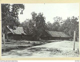 PORT MORESBY, NEW GUINEA. 1944-05-01. A SECTION OF THE ADMINISTRATION AREA, SHOWING G AIR OFFICE. G OPERATIONS AND BATTLE ROOM, HEADQUARTERS NEW GUINEA FORCE IS LOCATED IN THE BUILDING AT THE RIGHT