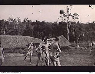 SOGERI VALLEY, NEW GUINEA. 1943-06-25. TROOPS OF THE 11TH AUSTRALIAN FIELD AMBULANCE, MAIN DRESSING STATION, PLAYING SOCCER DURING ONE OF THEIR RECREATION PERIODS. SHOWN ARE:- N243119 PRIVATE (PTE) ..