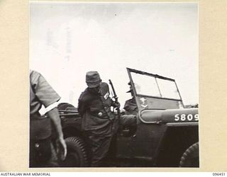 CAPE WOM, NEW GUINEA, 1945-09-13. LIEUTENANT-GENERAL H. ADACHI, COMMANDER 18 JAPANESE ARMY IN NEW GUINEA ALIGHTING FROM JEEP AT CAPE WOM AIRSTRIP. LIEUTENANT-GENERAL ADACHI FORMALLY SURRENDERED TO ..