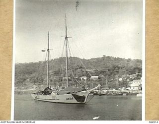 PORT MORESBY, NEW GUINEA. 1944-06-14/02. THE AK94 A VESSEL OF THE 12TH SMALL SHIPS COMPANY. THIS VESSEL WAS FORMERLY THE "ABEL TASMAN", A KETCH-RIGGED SCOW, BUILT IN TASMANIA IN 1942. SHE IS 98 ..